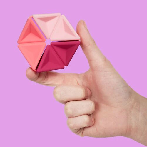 speks-pivot-silicone-fidget-pink-hand_500x.webp