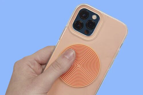 speks-slabs-silicone-sensory-sticker-circle-groove-orange-phone_500x.webp